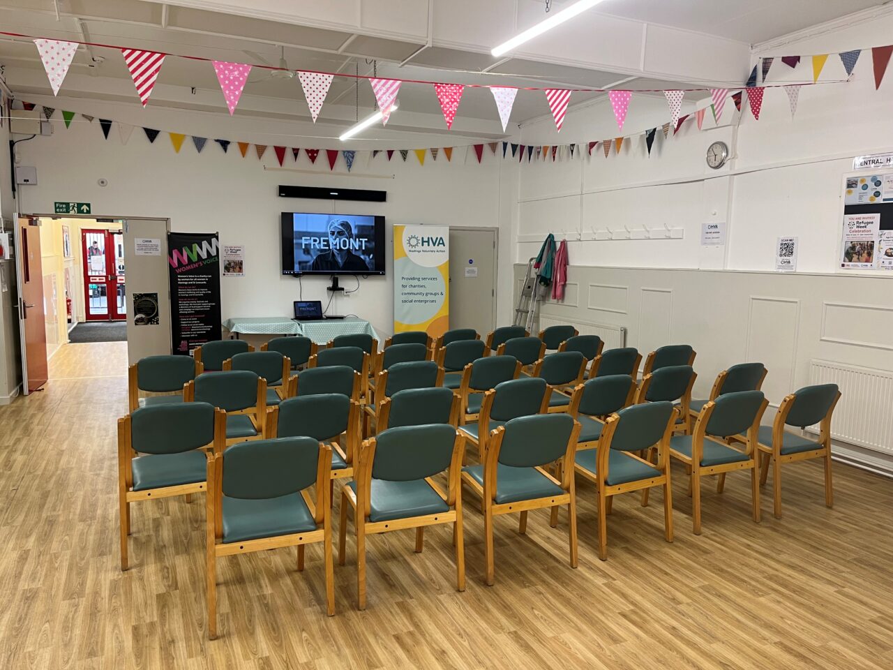 Central Hall with room set out with lots of rows of chairs facing the screen